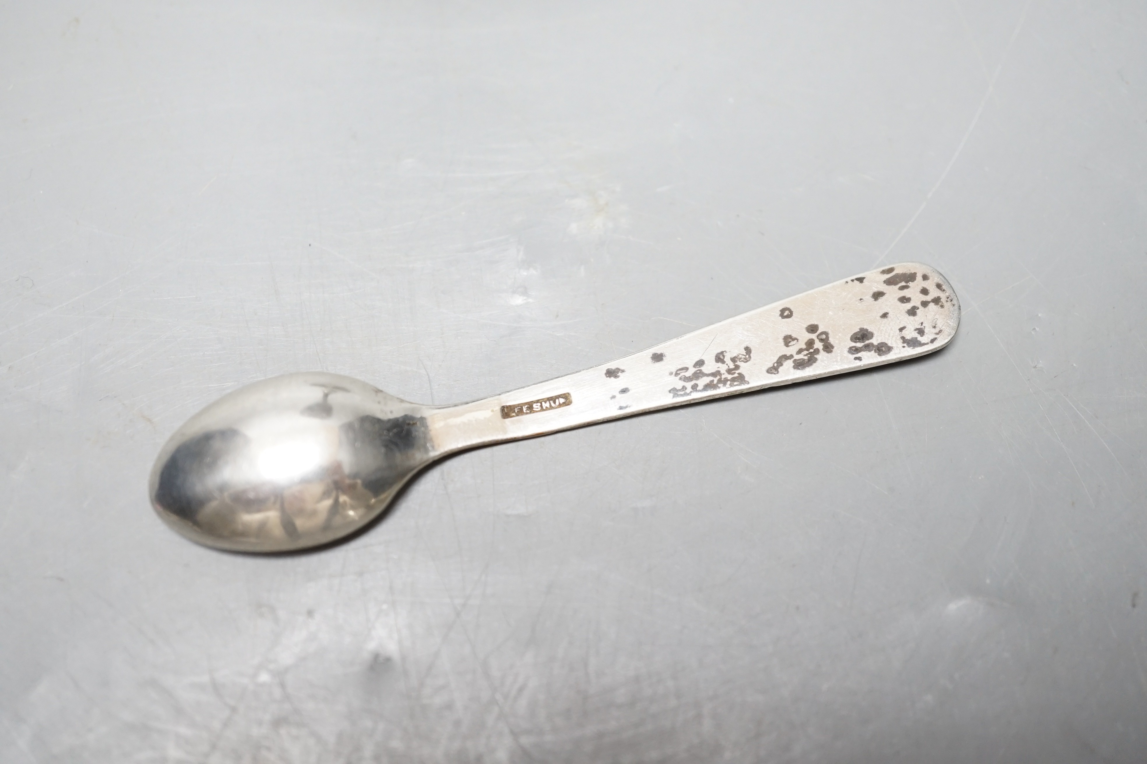 An early 20th century Chinese Export white metal dragon ‘egg’ cup and spoon, by Zee Shun, cup 76mm.